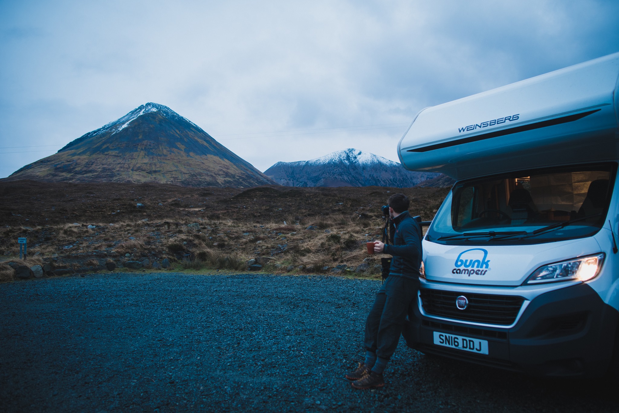 Admiring the mountains with a Bunk Camper